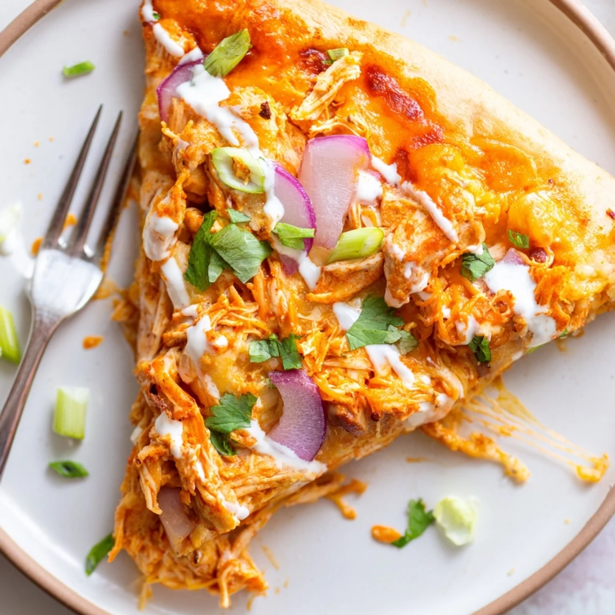 Golden crust pizza topped with spicy buffalo chicken, red onion, scallions, and melted mozzarella cheese. 