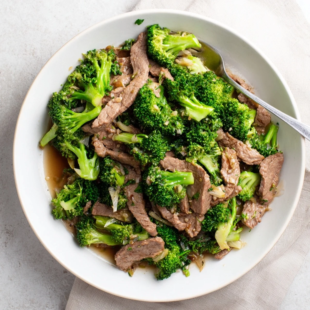 Glossy beef and broccoli stir-fry glistening with savory garlic sauce over white rice