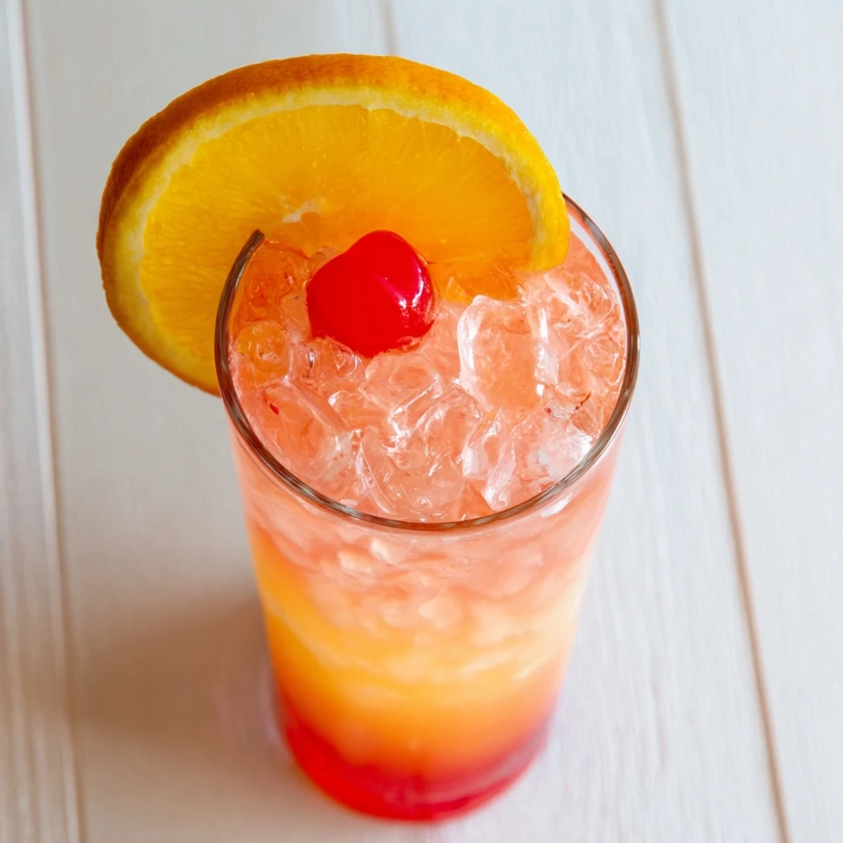 Classic Easy Shirley Temple Drink displaying fizzy layered soda with rosy grenadine and fresh orange slice