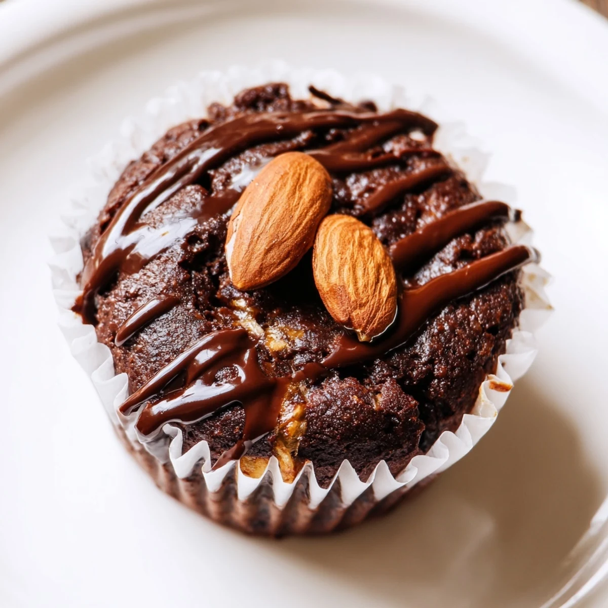 Moist flourless almond joy cupcakes crowned with sweet coconut filling and crunchy almonds