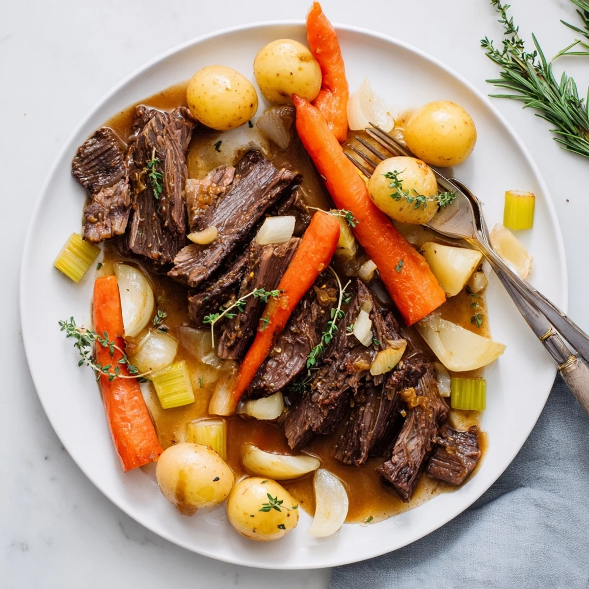 Herb braised beef chuck roast served with tender vegetables and rich, flavorful gravy