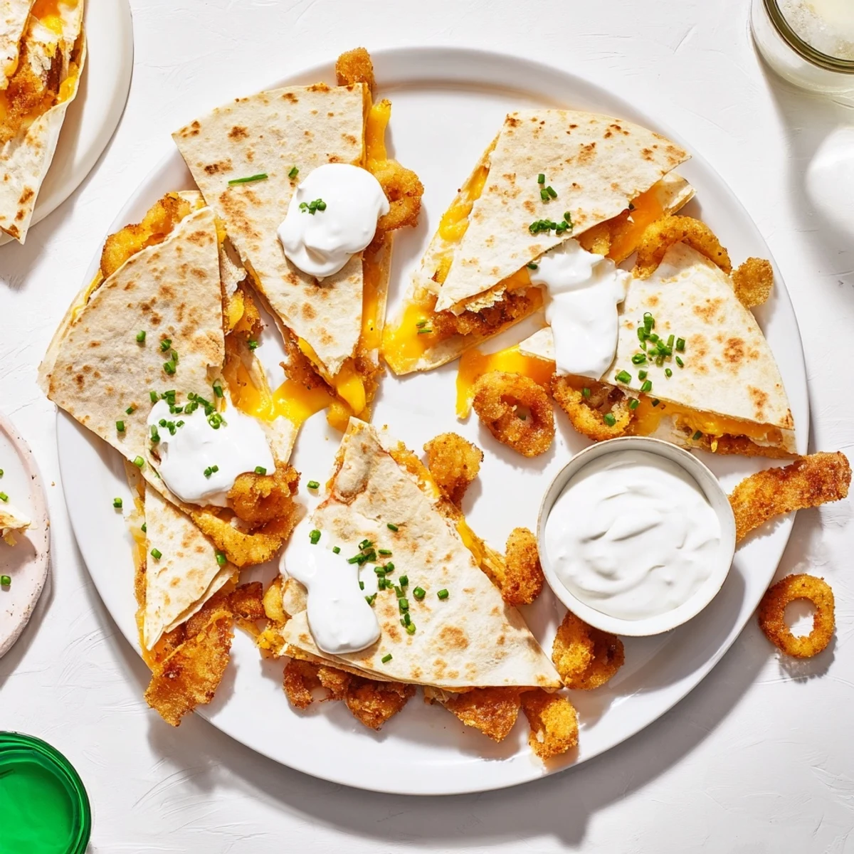 Golden quesadilla filled with crispy onion ring chips and layers of melted cheddar cheese
