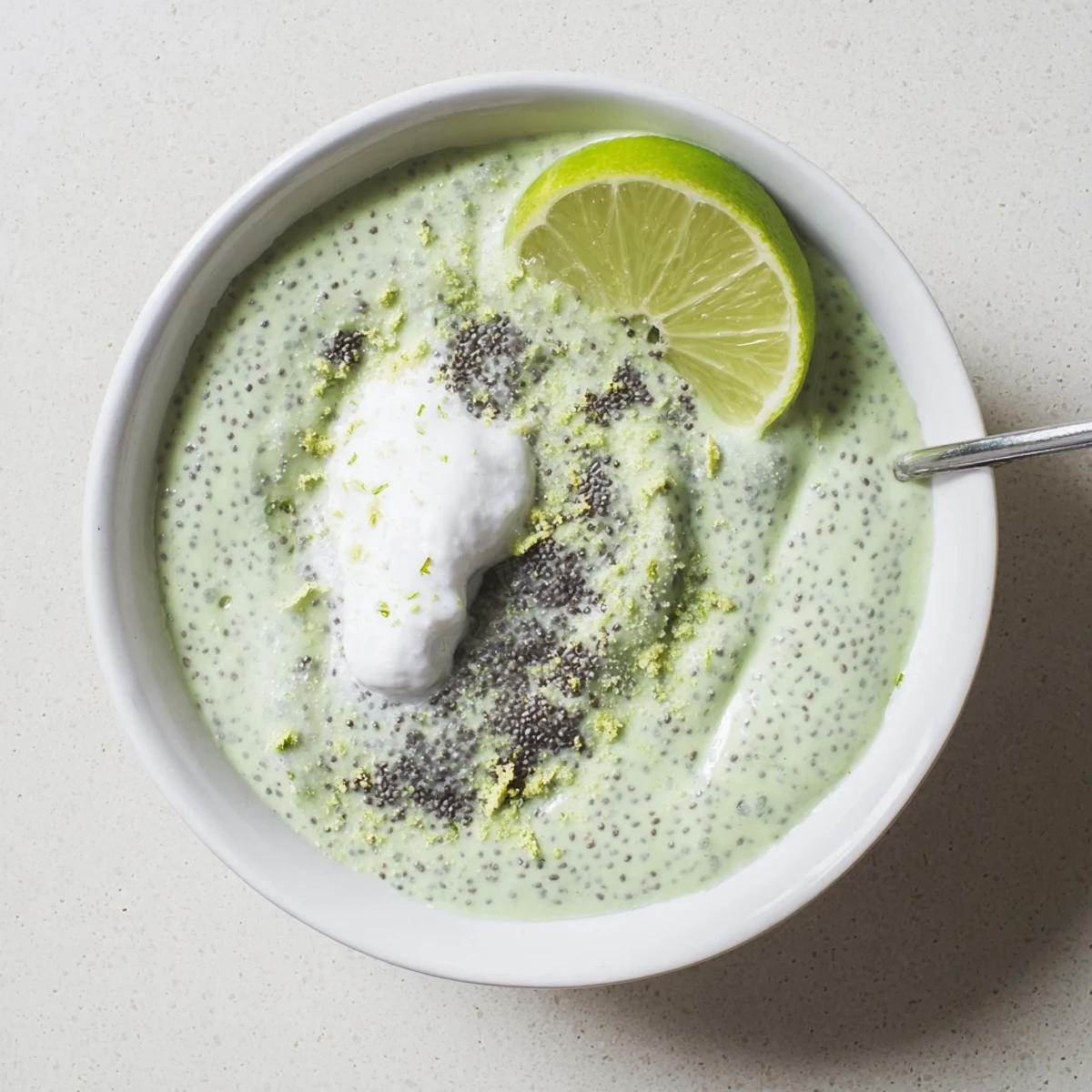 Chilled Key Lime Chia Pudding served with spoon, tangy and refreshing