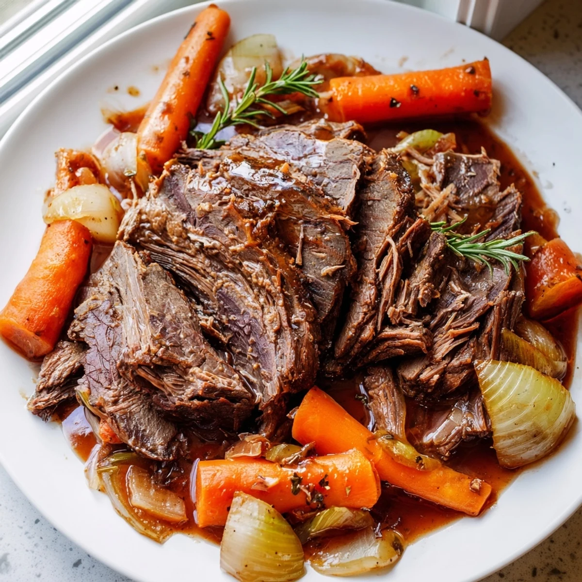 Perfect pot roast sliced thick alongside caramelized vegetables in a deep mahogany braising liquid